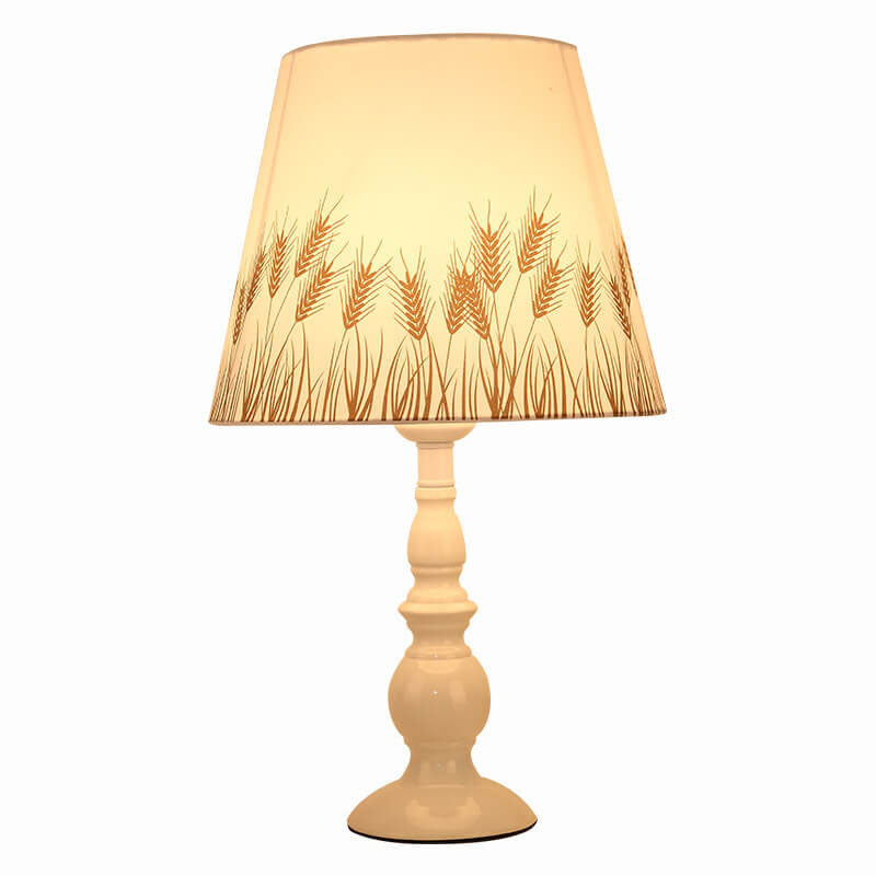 Moderne, schlichte Tischlampe mit Blumenmuster und Eisenvase